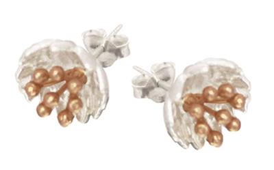 Pair of silver and rose gold leaf-shaped earrings on a white background