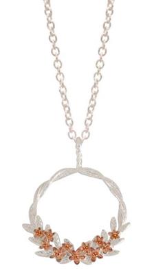 Silver necklace with a floral pendant featuring orange stones on a white background